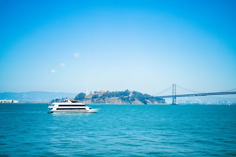 a large white boat floating on top of a large body of water