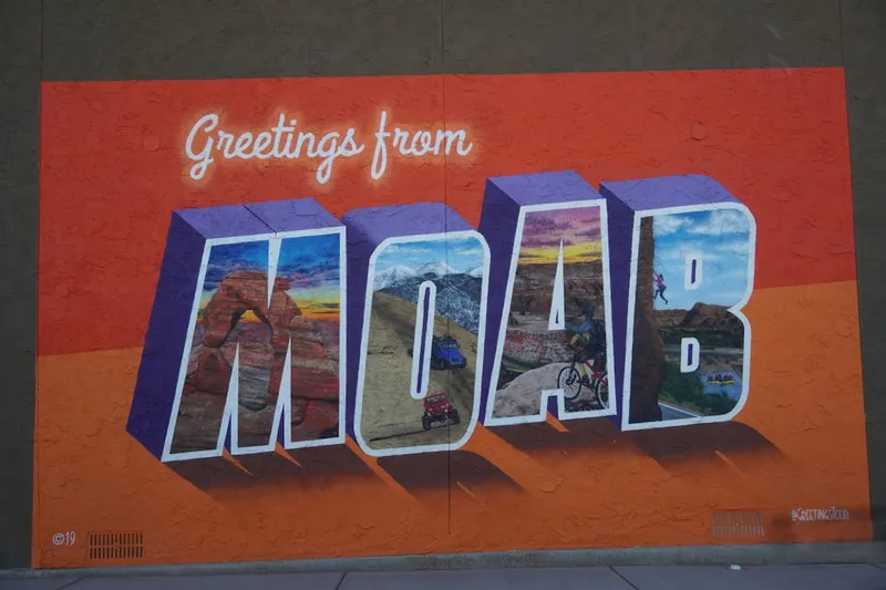 a mural of the word moab painted on the side of a building