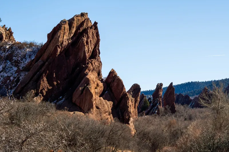 a group of large rocks in the middle of a field